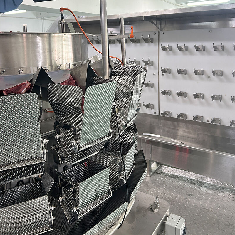 Linea automatica di confezionamento in vaschette con pesatrice a teste multiple e alimentazione a vite per prodotti surgelati